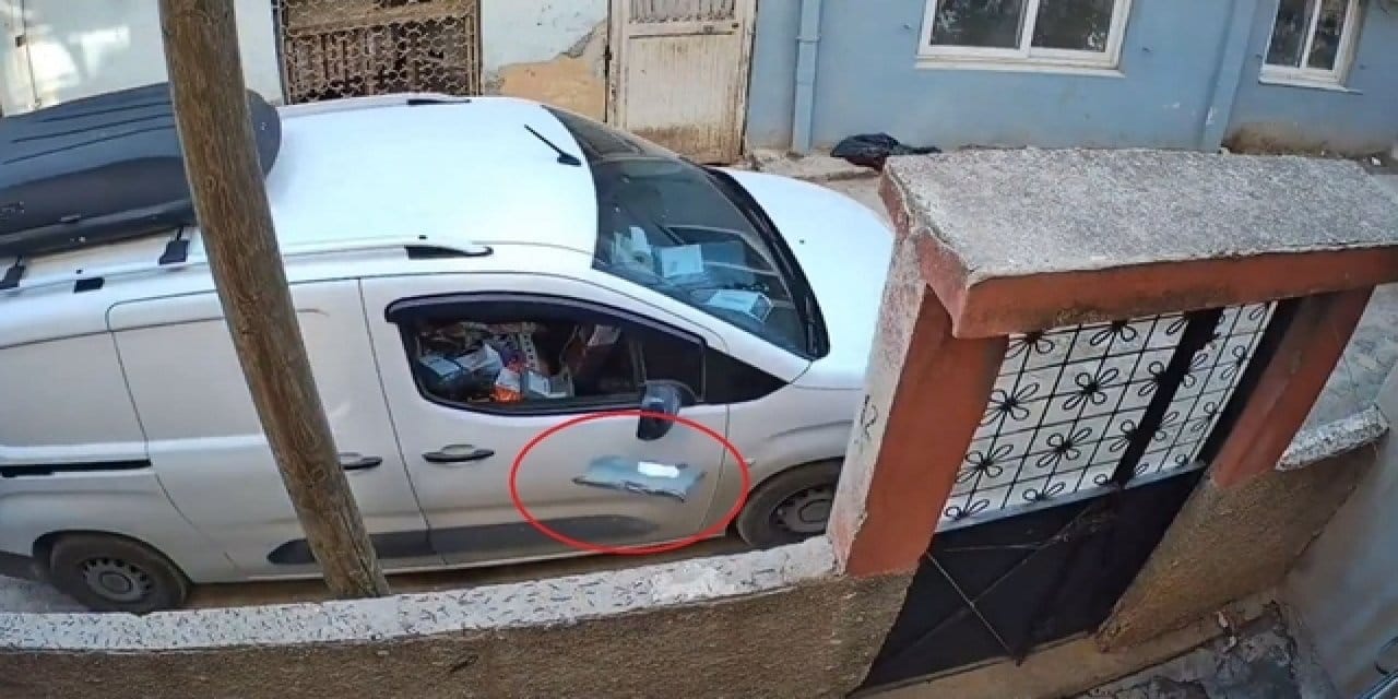 Paketi araçtan fırlatan kargo görevlisi kameraya yakalandı